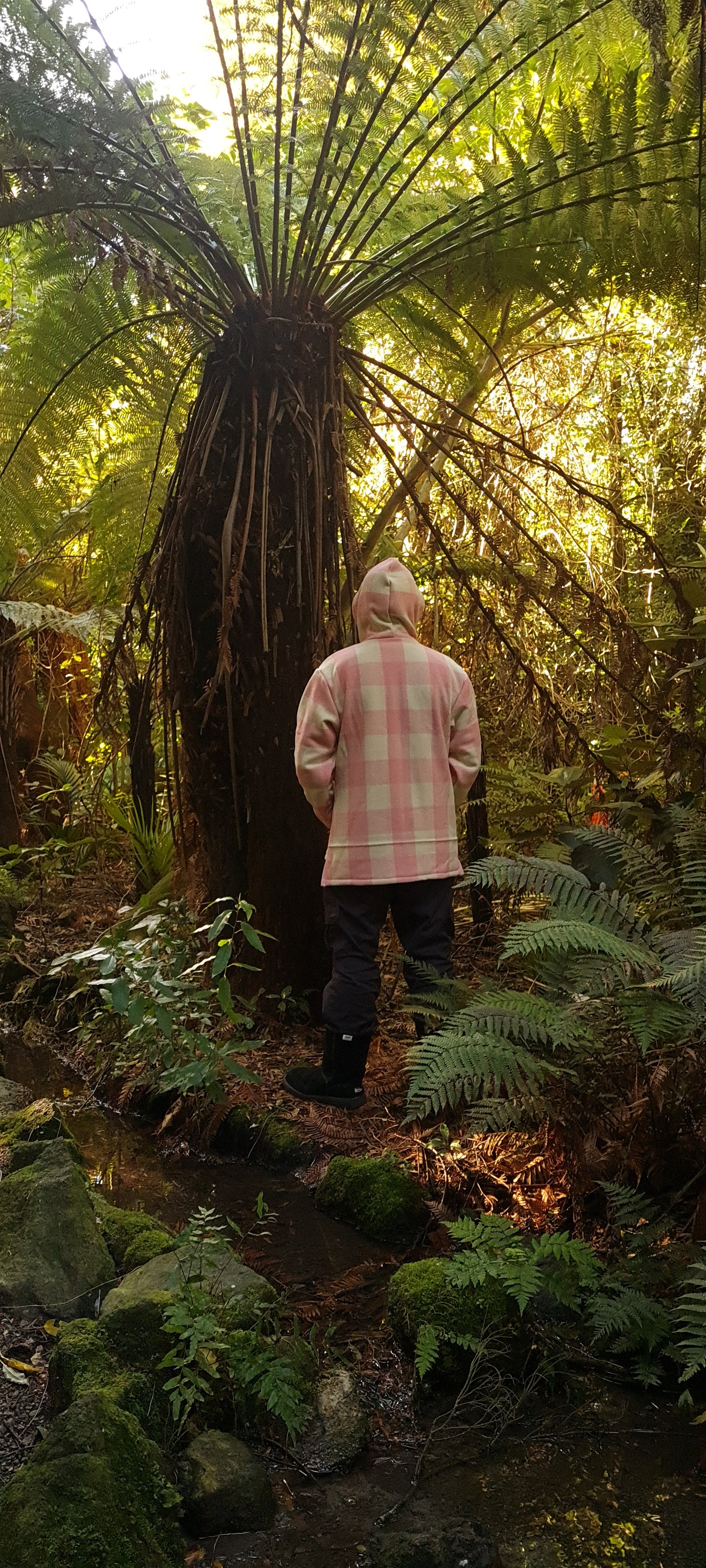 Wrap yourself in the comfort of NZ craftsmanship with the Checked Pink/White Raumoa Wool Anorak Jacket, a locally-made woolen masterpiece designed for style and warmth. back picture.