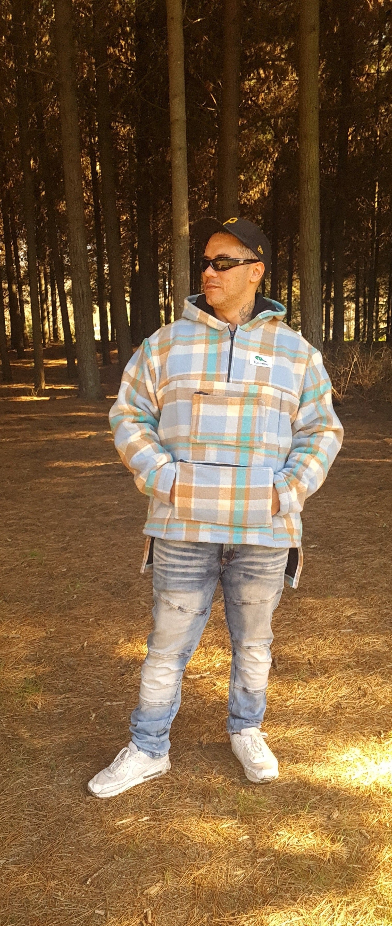 Hit the trails in style with the Checked Light Blue/Brown Raumoa Wool Anorak Jacket, a trendy hiking jacket designed for comfort and outdoor exploration. front picture