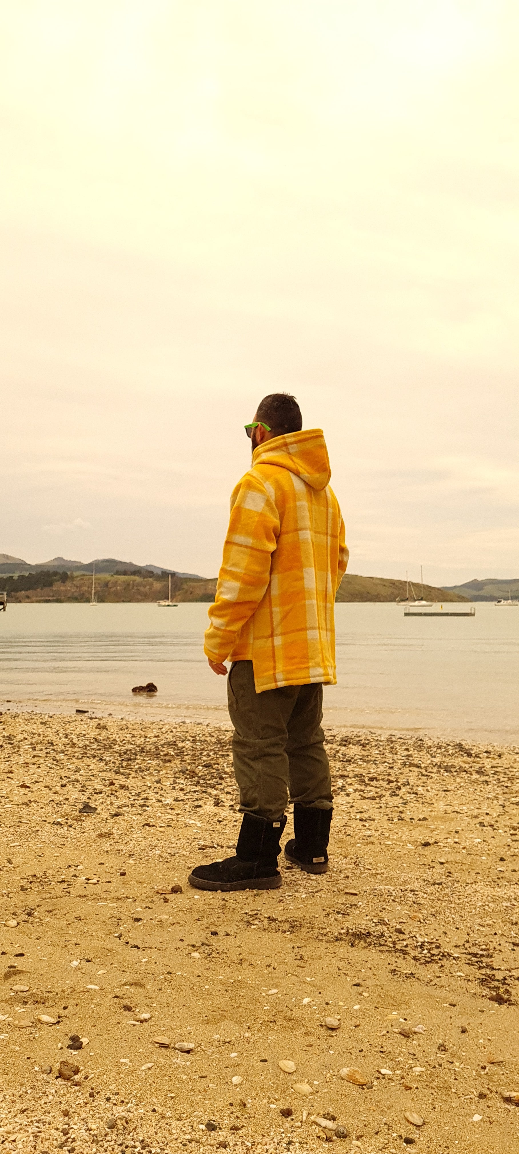 Elevate your outdoor wardrobe with the Checked Yellow Raumoa Wool Anorak Jacket, a statement piece that brings a burst of color to your outdoor escapades. side picture