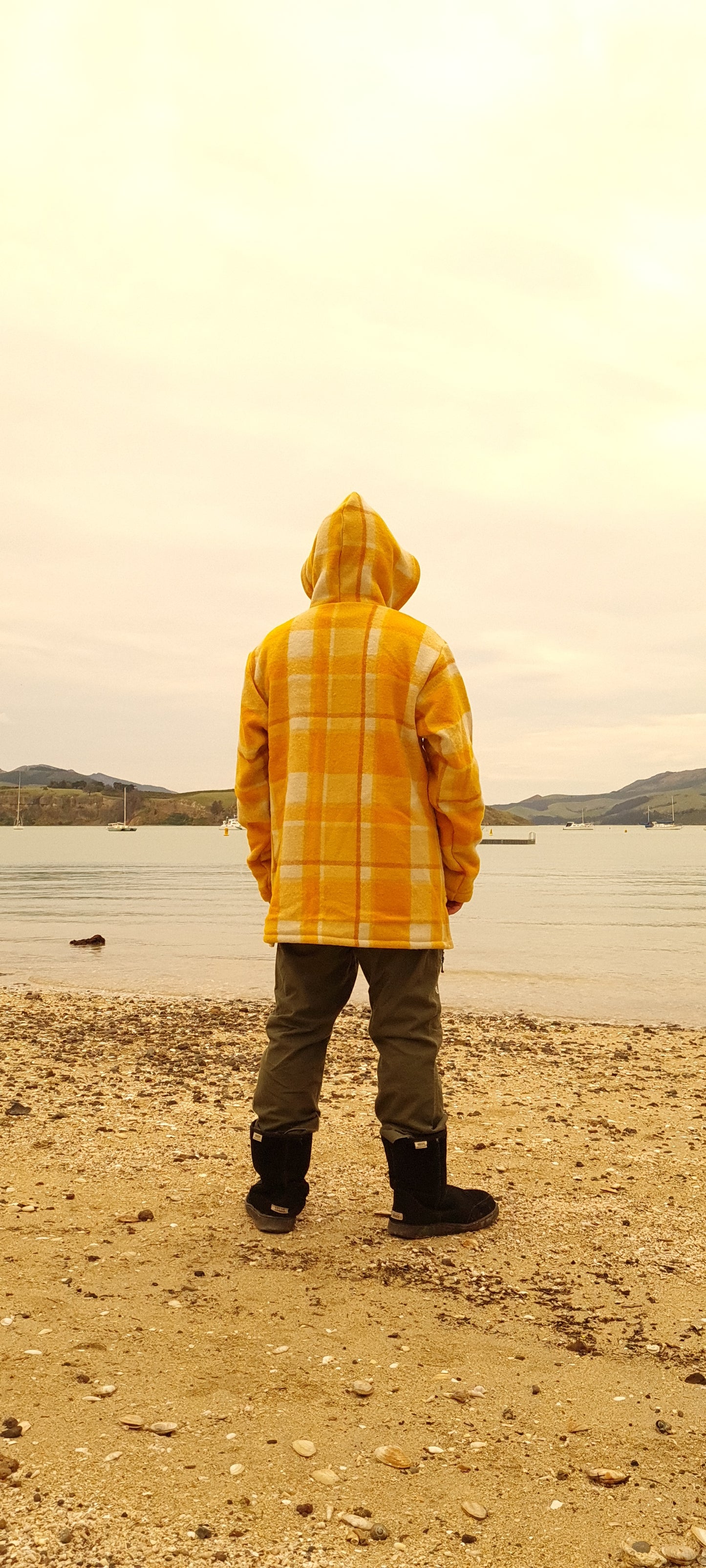 Experience the perfect blend of fashion and rugged durability with the Checked Yellow Raumoa Wool Anorak Jacket, your go-to outdoor jacket for all seasons. back picture