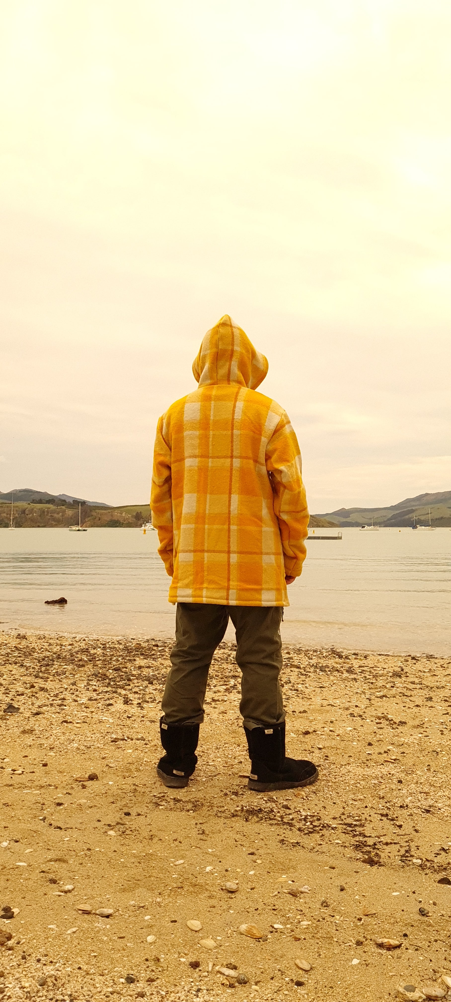 Experience the perfect blend of fashion and rugged durability with the Checked Yellow Raumoa Wool Anorak Jacket, your go-to outdoor jacket for all seasons. back picture