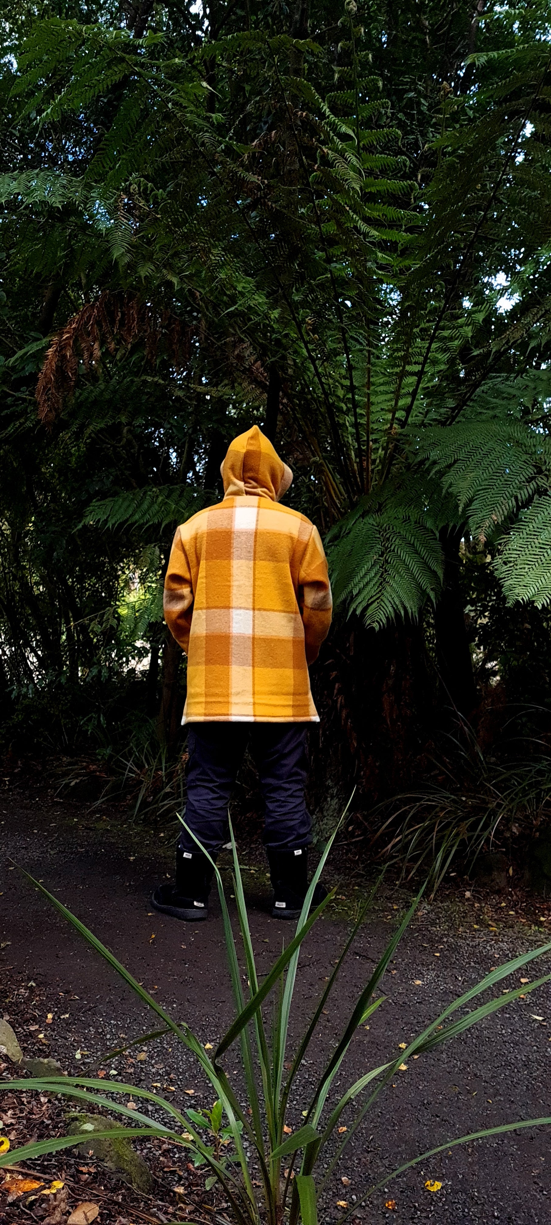 Make a bold impact on sustainable fashion with the Checked Yellow/Brown Raumoa Wool Anorak Jacket, a carefully crafted, upcycled wool masterpiece that redefines ethical chic. back picture