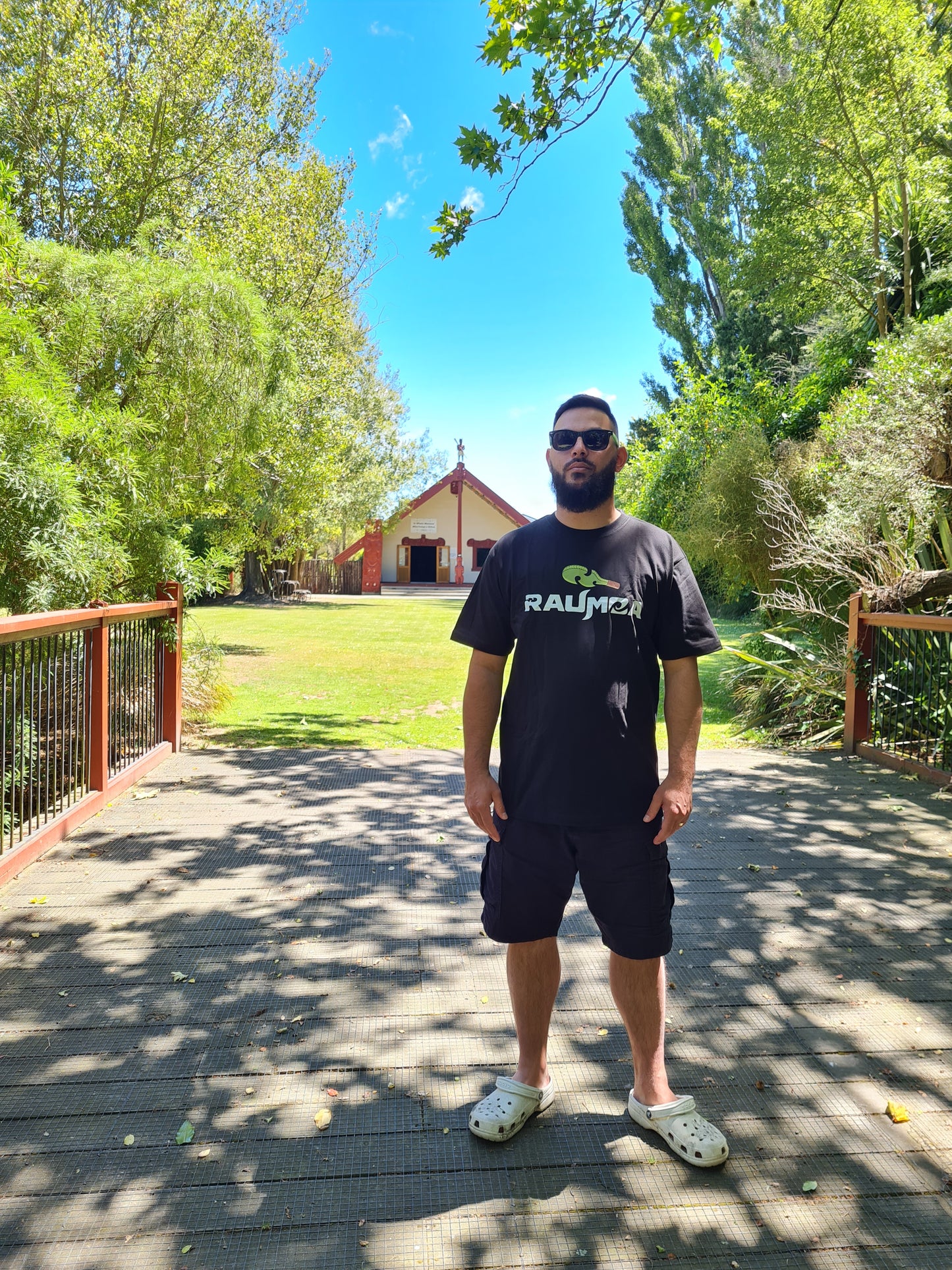 the Maori Clothing black T-shirt Elevate your style with this captivating T-shirt featuring intricate Maori designs clothing. Immerse yourself in the rich cultural front with the raumoa logo, a perfect fusion of tradition and contemporary flair. [Image: color View of black t shirt.]