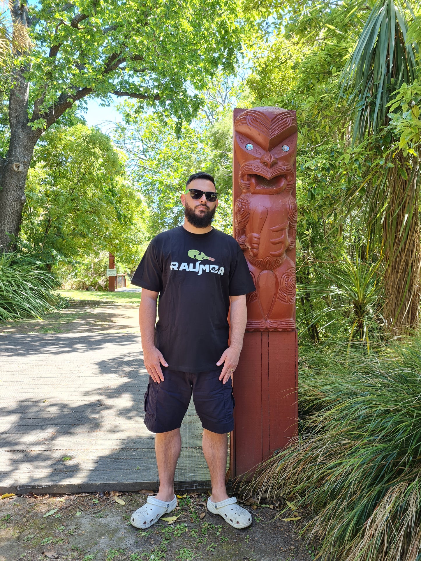 the Maori-themed black T-shirt Elevate your style with this T-shirt embodying the essence of Maori culture, showcasing distinctive Maori clothing, contemporary Maori wear, and intricate Maori design clothing. A harmonious blend of tradition and fashion awaits in every stitch. [Image: front View of black t shirt.]