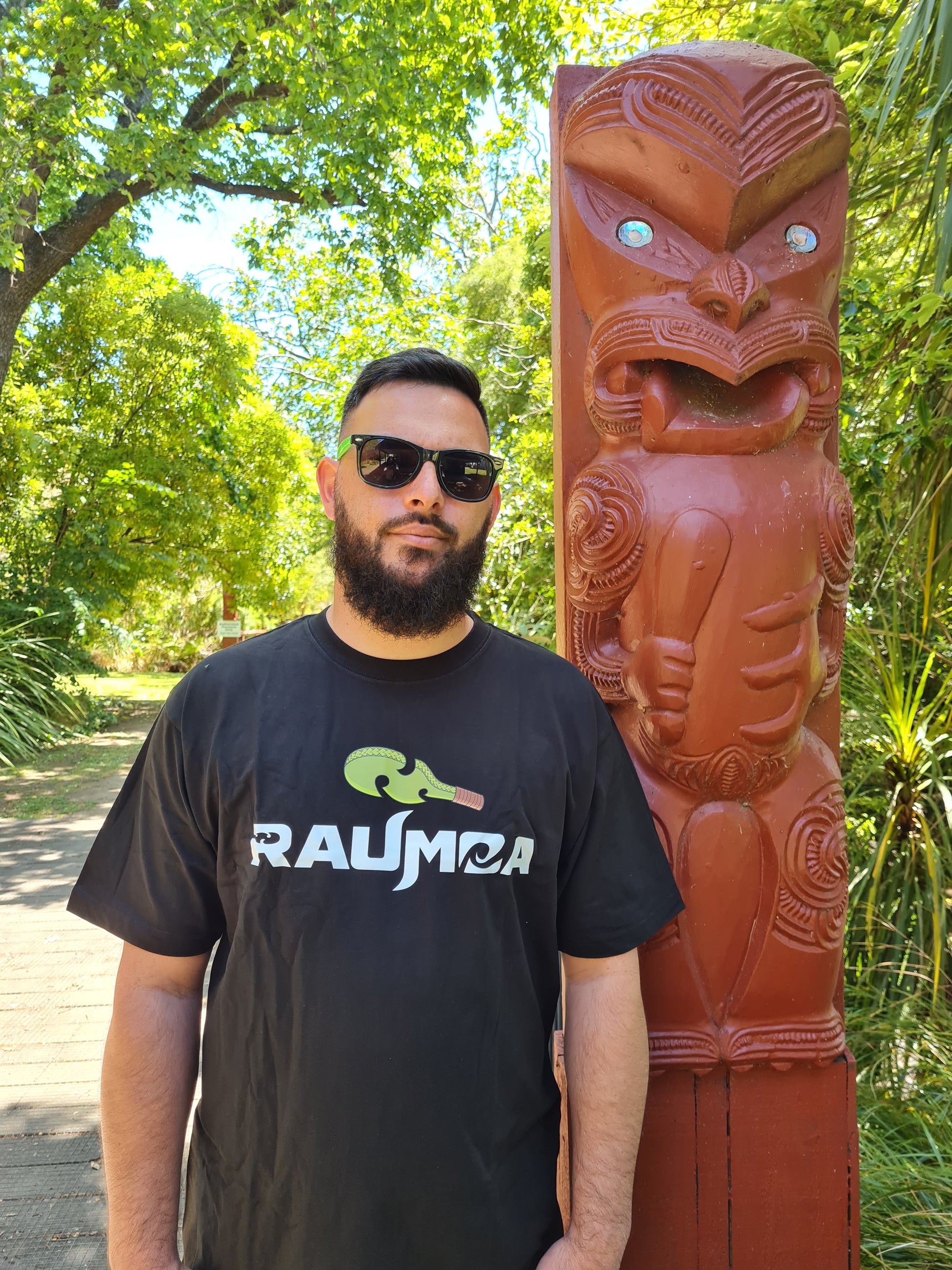 Maori-inspired black T-shirt Embark on a style journey with this T-shirt, featuring captivating Maori wear elements and artistic designs. [Image: close View of black t shirt.]