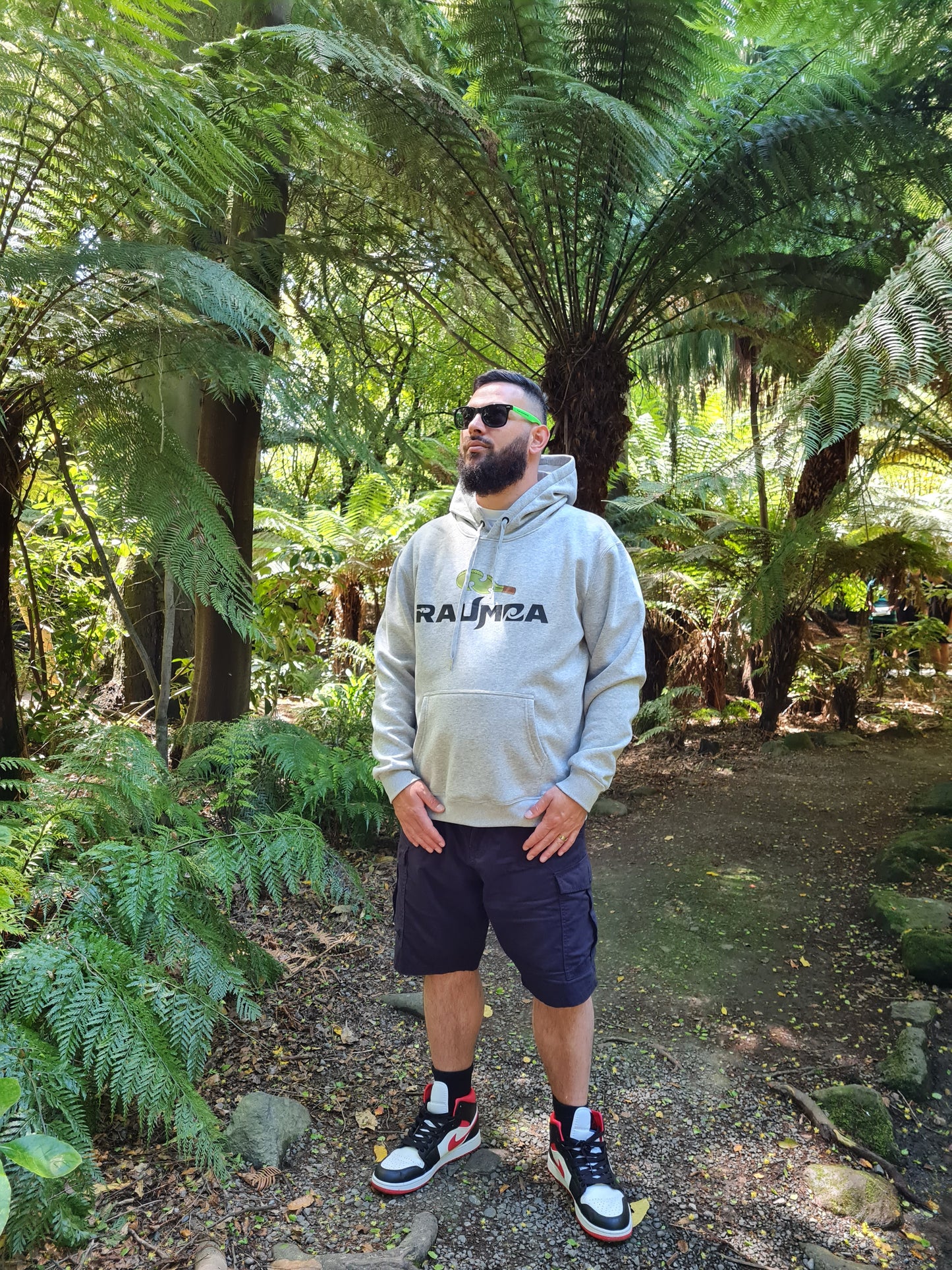 Step into the authentic  Maori streetwear with our exclusive grey hoodie. Crafted for comfort and style, this piece embodies the essence of Authentic maori clothing. Elevate your streetwear game with cultural flair. Explore our collection online [Image: side View of grey Hoodie.]