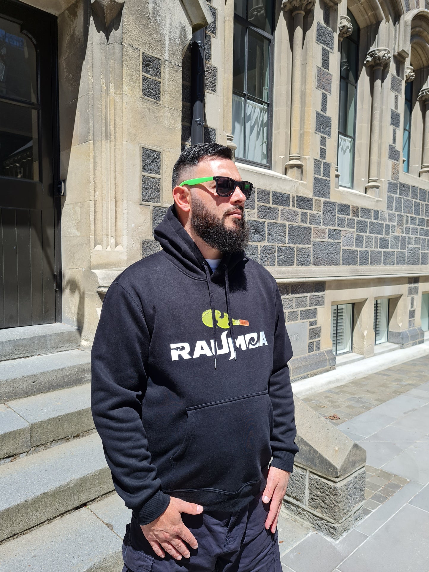 Experience the fusion of style with our Maori cultural wear black hoodie. Immerse yourself in the artistry of Maori clothing, where heritage meets innovation. Elevate your wardrobe with authentic designs and quality craftsmanship. [Image: right side view