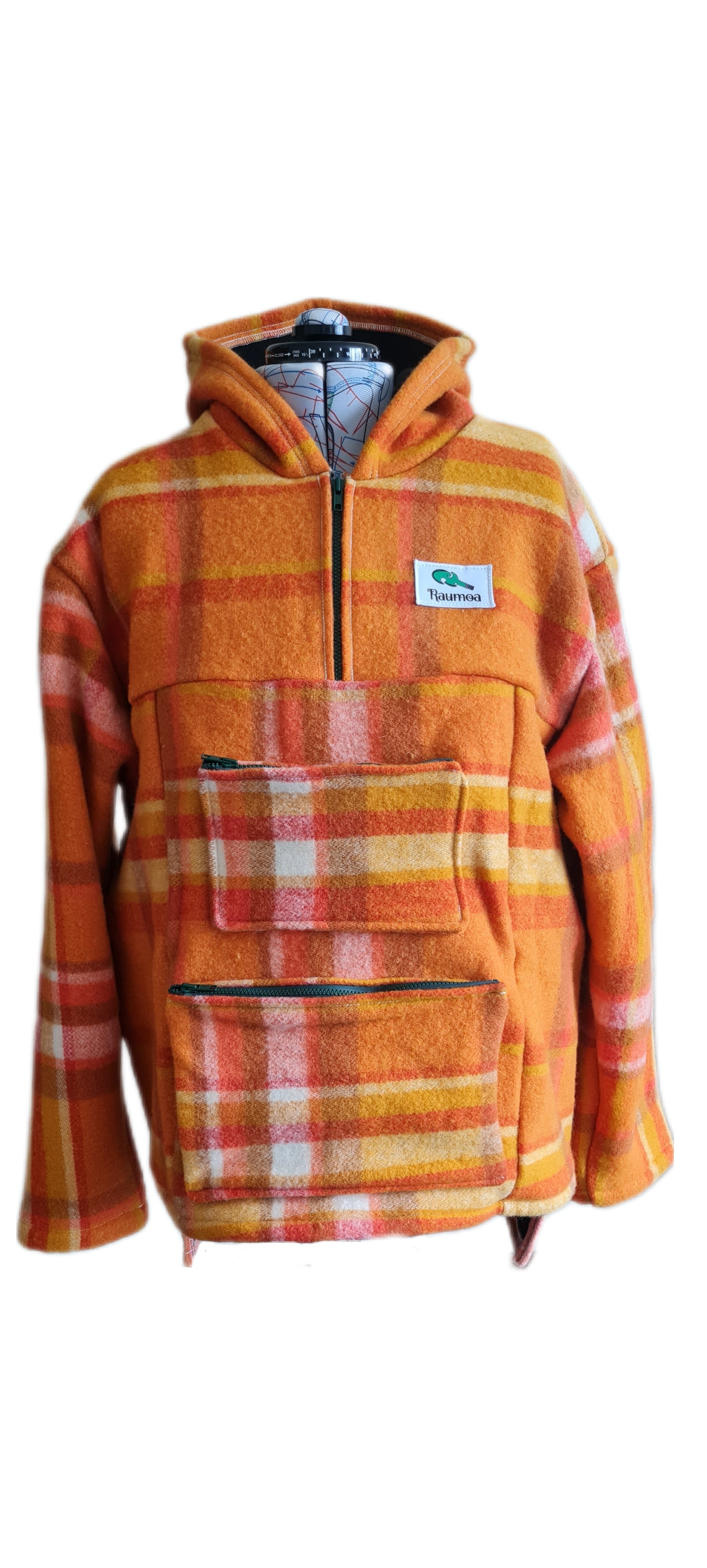 Gear up for the great outdoors with the checked orange Raumoa Wool Anorak Jacket, a stylish hunting jacket designed to accompany you on your hunting adventures.