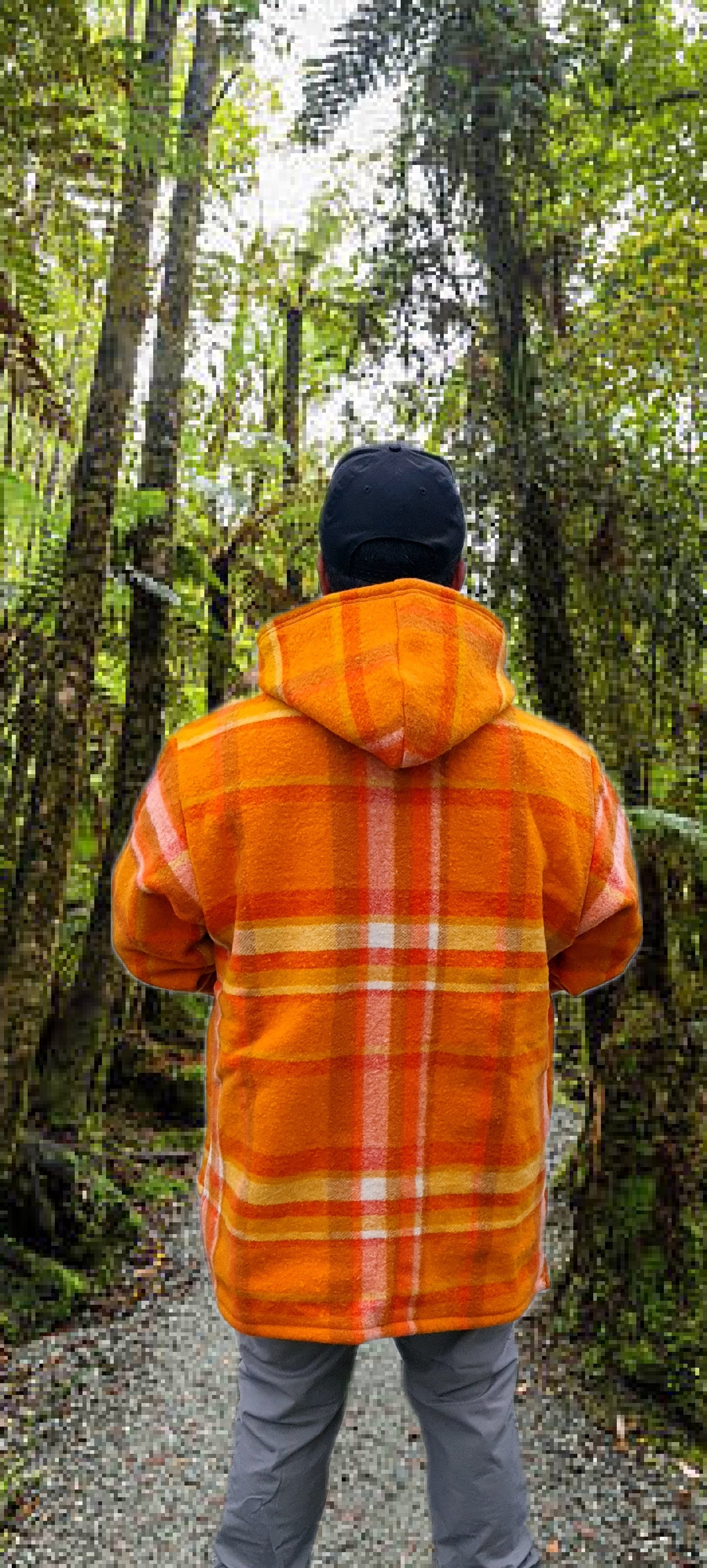 Capture the essence of fall with the Checked Orange Raumoa Wool Anorak Jacket, a fashionable and comfortable outer layer for cooler days. back picture