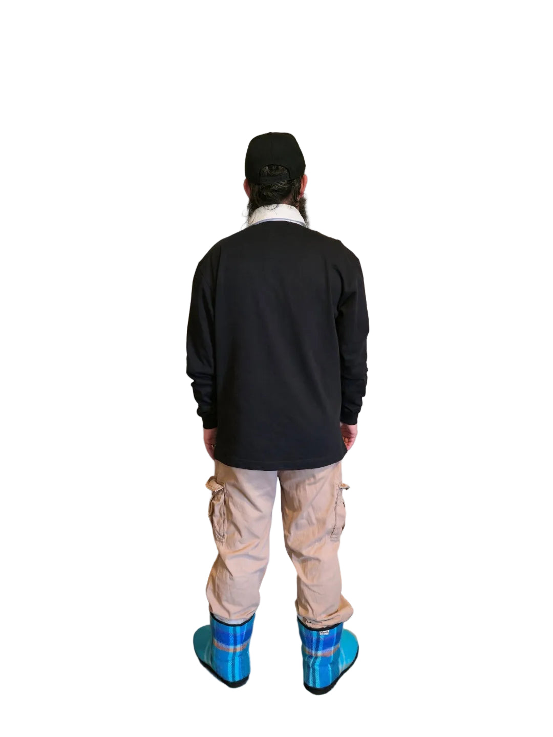 A person viewed from behind wearing a black long-sleeve rugby  shirt, beige cargo pants,